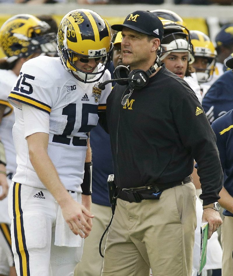 According to Chicago Tribune columnist Teddy Greenstein, Michigan Coach Jim Harbaugh (right) is no stranger to over-recruiting.