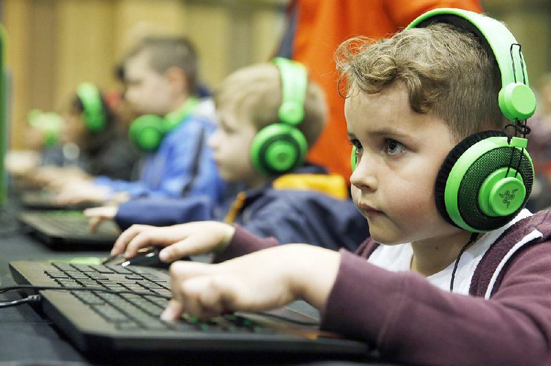 Visitors play Minecraft at the Legends of Gaming Live event in London in September.