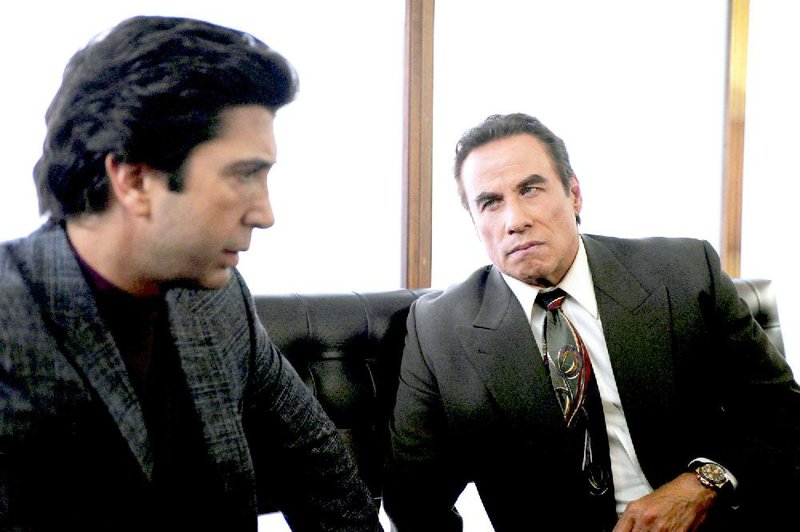 David Schwimmer (left) stars as Robert Kardashian and John Travolta plays Robert Shapiro in FX’s The People v. O.J. Simpson: American Crime Story.