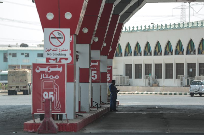 A worker waits for cars at a gas station in Mecca, Saudi Arabia. Khalid al-Falih, the chairman of Saudi Arabia's state oil giant says plans for a possible initial public offering are not being driven by a need for cash amid a global slump in oil prices, but instead signal a desire for greater openness to outside investors. Al-Falih spoke on Monday, Jan. 25, 2016, at an investment conference in Saudi Arabia.