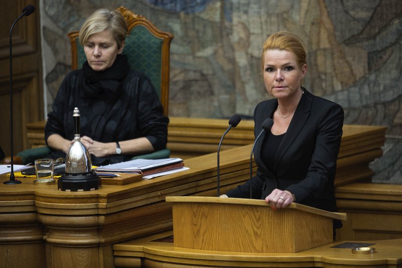 Minister of Integration from the Liberal Party Inger Stoejberg, right, and Mette Bock attend Parliament, in Copenhagen on Tuesday Jan. 26, 2016. Denmark's Parliament is expected to vote allow police seizing valuables worth more than $1,500 from asylum-seekers to help cover their housing and food costs while their cases were being processed. (Peter Hove Olesen/ POLFOTO via AP)