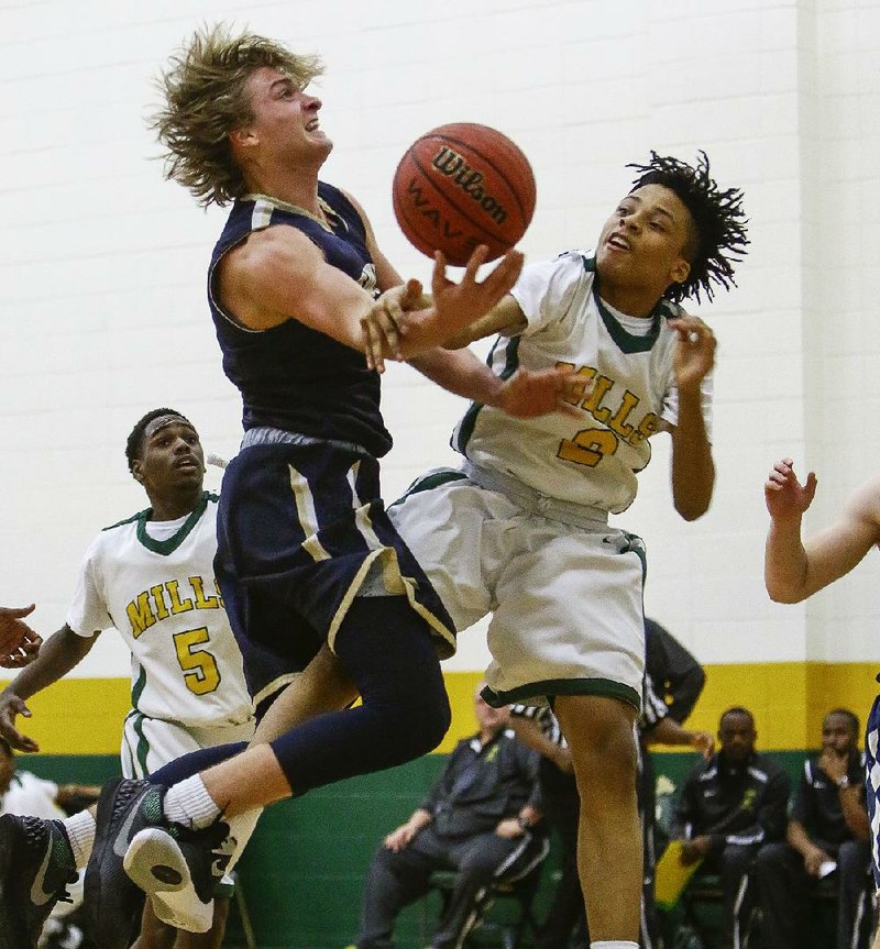 Pulaski Academy guard Lawson Korita (left) is fouled by Mills guard Grehlon Easter during the second quarter of the Bruins’ 71-52 victory over the Comets on Tuesday.
