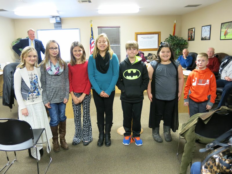 Photo by Susan Holland Fourth-grade students from K-Kids, a Kiwanis sponsored club at Gravette Upper Elementary School, attended the January Gravette school board meeting. They reported on their club activities and led the pledge of allegiance to open the meeting. Pictured, left to right, are Maddie Lovell, Tori Majdan, Dalacie Wishon, Ashley Rangel, Hayden Kellhoffer, Carlee Hembree and Jake Mayo.