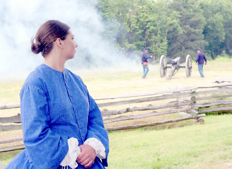 File photograph Serena Rothfus, or Sessie, the mascot of the sesquicentennial a few years ago of the Battle of Pea Ridge, turned toward civil war re-enactors after they fired a canon to remember fallen soldiers on the Battlefield at Pea Ridge National Military Park.