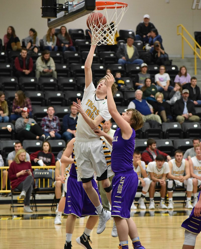 Photo by Shelley Williams/Prairie Grove&#8217;s Cameron Simmons, who has provided valuable minutes off the bench this season, skies for a bucket during a Jan. 15 loss against Berryville.