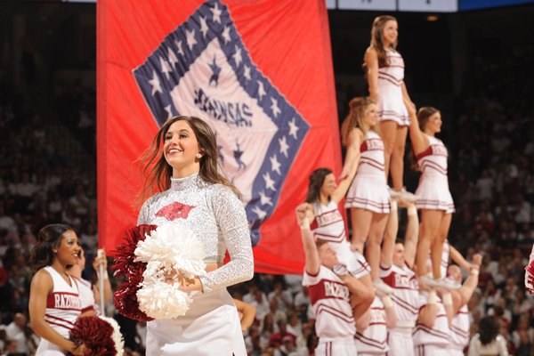 Arkansas cheerleaders display the state flag during a timeout on Thursday, Jan. 21, 2016, as the Razorbacks played No. 23 Kentucky at Bud Walton Arena in Fayetteville.