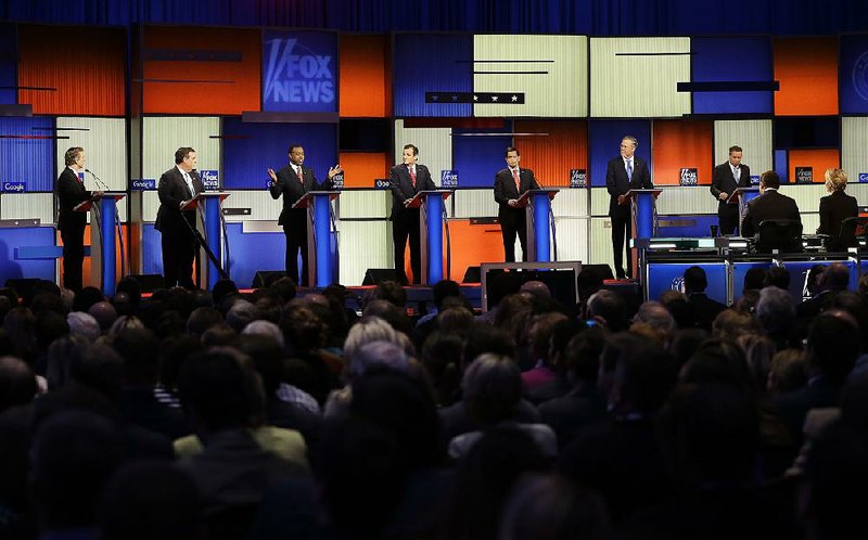Republican rivals (from left) Rand Paul, Chris Christie, Ben Carson, Ted Cruz, Marco Rubio, Jeb Bush and John Kasich take part in Thursday’s presidential primary debate in Des Moines, Iowa.
