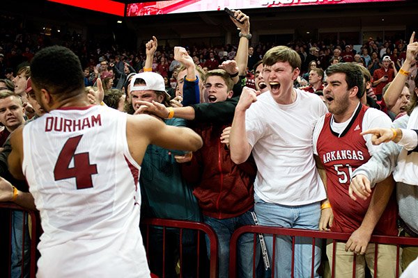 Arkansas fans celebrate following the upset win over Texas A&M in an NCAA college basketball game in Fayetteville, Ark., Wednesday, Jan. 27, 2016. Arkansas won 74-71. (AP Photo/Sarah Bentham)
