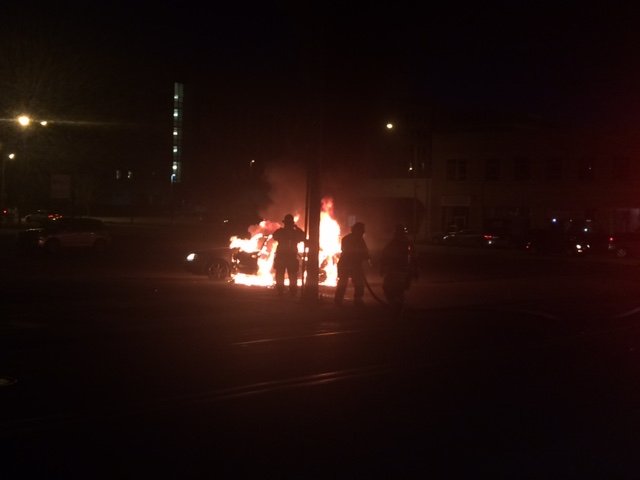 Firefighters worked to extinguish a car fire Friday night near the intersection of Broadway and Capitol Avenue in Little Rock.