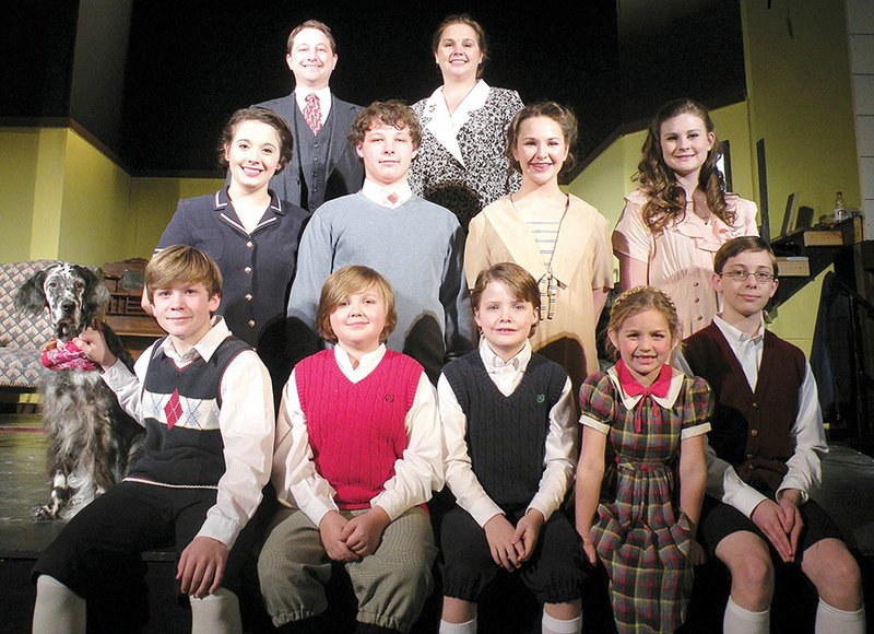 Portraying members of the Gilbreth family in The Royal Players’ upcoming production of Cheaper by the Dozen are, front row, from left, Luke Ferguson as Dan, holding on to the family dog, Shelby, a female English setter owned by Lori Buckner Martin of Pulaski County; Zachary Glover of Benton as Jackie; Collin Hutson of Benton as Fred; Berkeley Courtney-Moore of Little Rock as Lillian; and Jack Clay of Sheridan as Bill; middle row, Destiny Marchese of Little Rock as Anne; Nathan Clay of Sheridan as Frank; Meredith Medford of Bryant as Ernestine; and Ashley Cornwall of Bryant as Martha; and back row, Jeremy Clay of Sheridan as Mr. Gilbreth; and Tracy Courage of North Little Rock as Mrs. Gilbreth.