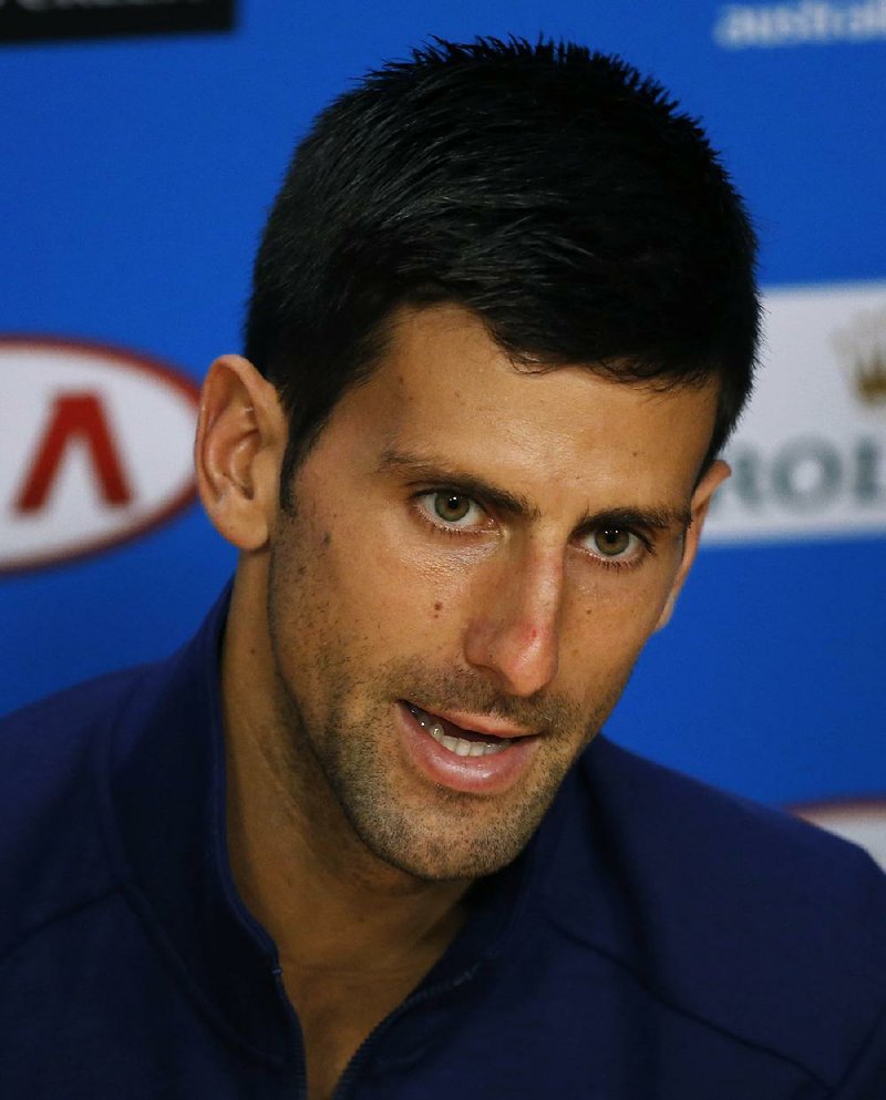 Novak Djokovic of Serbia answers questions at a press conference following his semifinal win over Roger Federer of Switzerland at the Australian Open tennis championships in Melbourne, Australia, Thursday, Jan. 28, 2016.