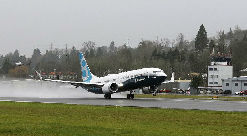 A Boeing 737 Max jet takes off for the fi rst time Friday in Renton, Wash. “It is an emotional experience,” a Boeing executive said.