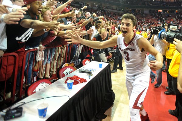 Arkansas guard Dusty Hannahs celebrates with fans after the Razorbacks overtime win over the Texas Tech Red Raiders Saturday, January 30, 2016, at Bud Walton Arena in Fayetteville.