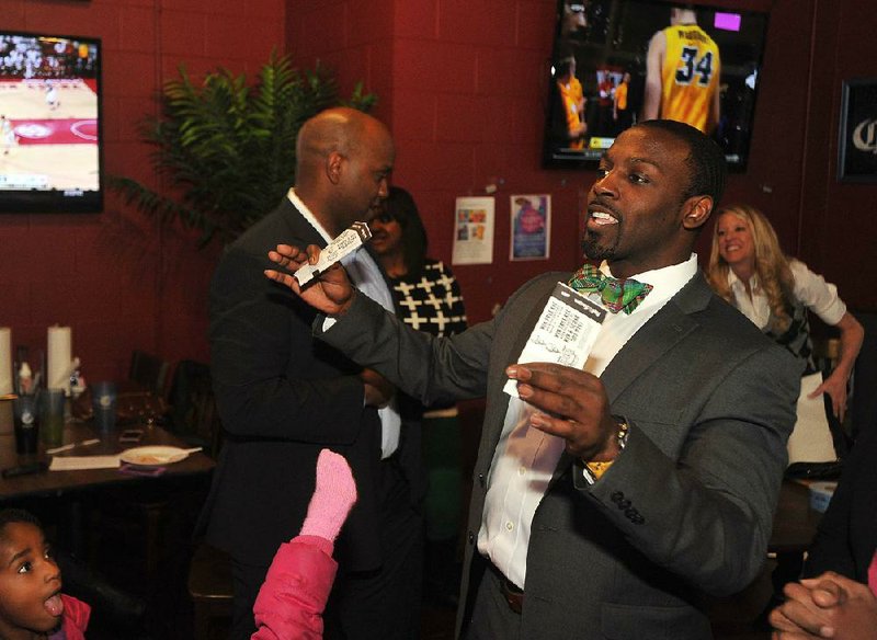 Reggie Brasfield, executive director of KDIV-LP 98.9 FM, speaks to supporters at a launch party in Fayetteville. The non-commercial radio station offers a mix of mix of hip-hop, R&B, jazz and gospel as well as community educational programming. 