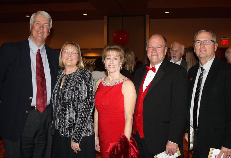Donny and Cheryl Story (from left), Angela and Mark Waldrip, UA Trustee and Dave Van Horn, UA baseball head coach, gather for a photo at the Razorback Foundation's Red Tie Dinner and Auction on Jan. 23 at the John Q. Hammons Center in Rogers.