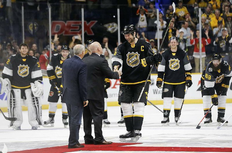 John Scott (center) was named MVP of the NHL All-Star Game on Sunday in Nashville, Tenn., after scoring two goals for the Pacific Division team. Scott, who was named captain by a fan vote, helped the Pacific defeat the Central Division 9-6 and 1-0 over the Atlantic Division.