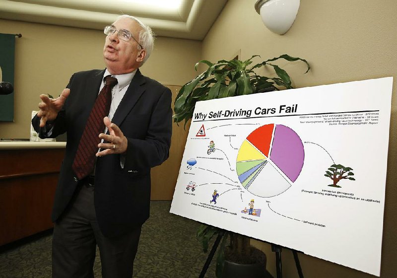 Consumer advocate John Simpson presents concerns about self-driving cars during a public hearing last week in Sacramento, Calif.