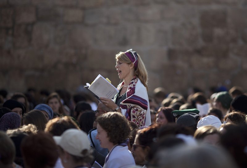 A woman prays at the Western Wall, the holiest site where Jews can pray in Jerusalem’s Old City.