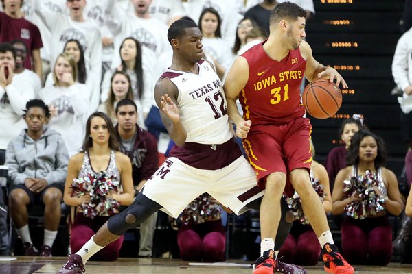 Iowa State's Georges Niang (31) tries to backdown Texas A&M's Jalen Jones (12) during the first half of an NCAA college basketball game, Saturday, Jan. 30, 2016, in College Station, Texas. Texas A&M won 72-62. (AP Photo/Sam Craft)