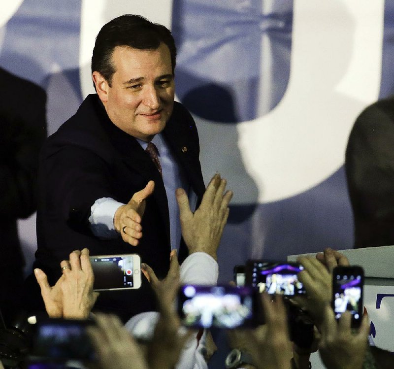 Republican presidential candidate Sen. Ted Cruz arrives for a caucus-night rally Monday in Des Moines, Iowa, to celebrate his victory in the Republican Iowa caucuses.