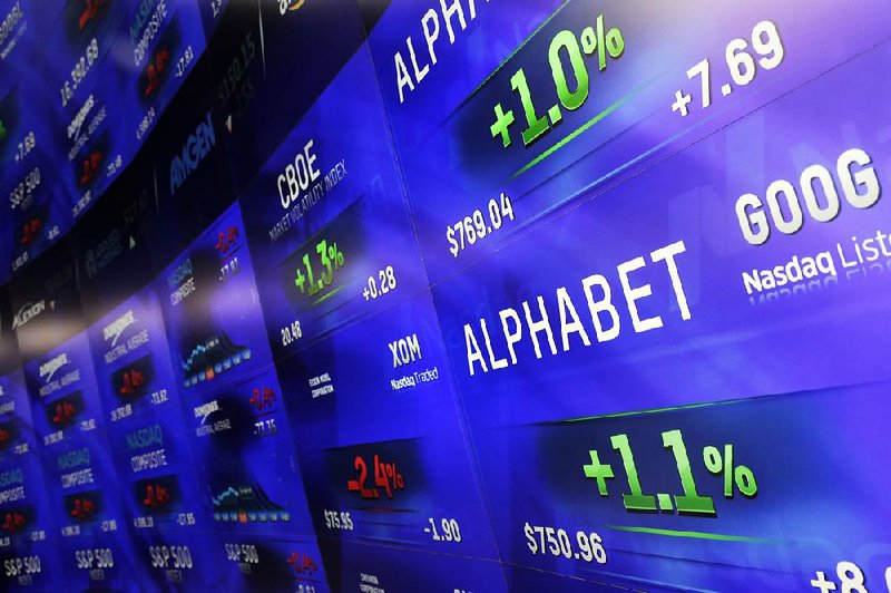 Electronic screens post prices of Alphabet Inc. on Tuesday at the Nasdaq MarketSite in New York. Alphabet, the parent company of Google, is now the world’s most valuable company. 