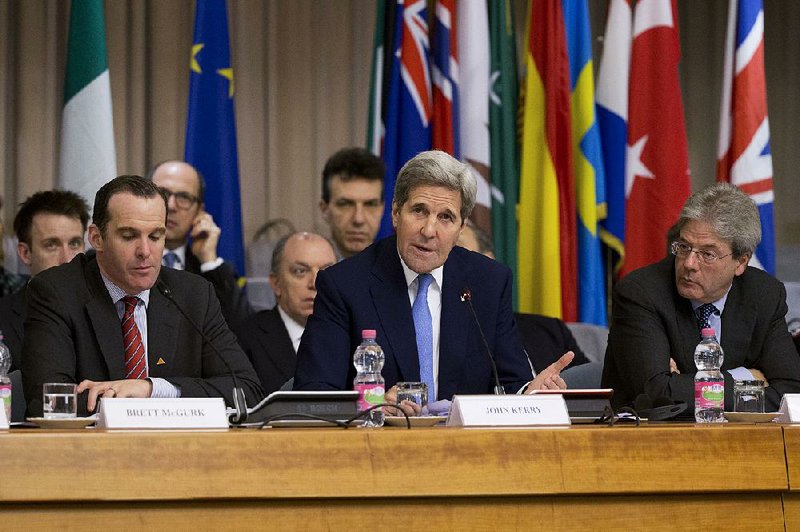 U.S. Secretary of State John Kerry is flanked by Brett McGurk (left), special presidential envoy to the U.S.-led coalition against the Islamic State group, and Italian Foreign Minister Paolo Gentiloni during a 23-nation conference Tuesday in Rome. 