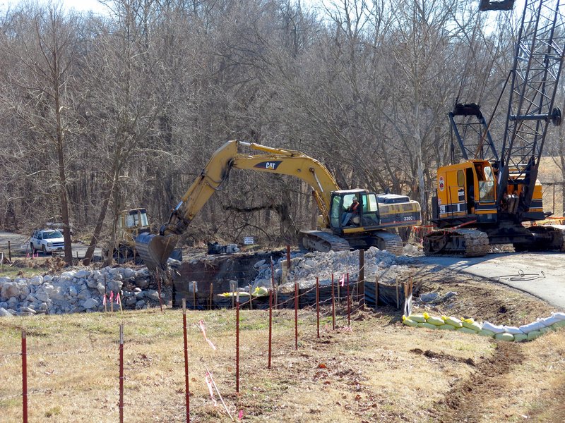 Photo by Susan Holland Stage Coach Road is closed while work is being done on the bridge over Spavinaw Creek. Workers were busy last Tuesday removing the existing bridge in order to construct a new bridge. The new bridge, which will cost an estimated $389,811, is expected to be complete by May 27.