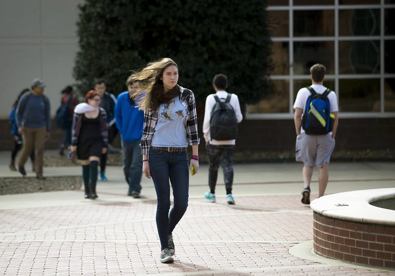 Students walk across campus Monday at Northwest Arkansas Community College in Bentonville.