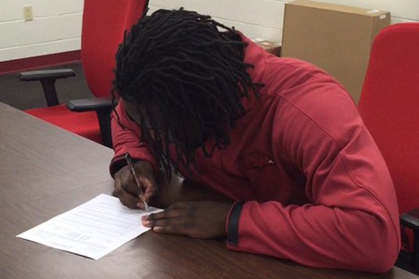 Thousands of players across the country will sign to play college football on Wednesday, Feb. 3, 2016, joining some players like Hope defensive end and Arkansas signee McTelvin Agim, who signed during the early signing period.