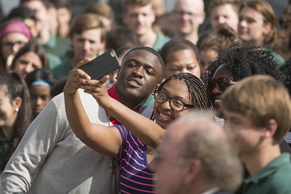 Nate Craig-Myers, left, poses for a selfie before announcing his commitment to Auburn during national signing day Wednesday, Feb. 3, 2016, at Tampa Catholic High School in Tampa Fla. (John Pendygraft/The Tampa Bay Times via AP)