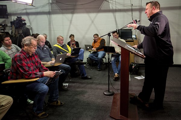 Arkansas coach Bret Bielema speaks with members of the media on Wednesday, Feb. 3, 2016, inside the Fred W. Smith Center in Fayetteville on the results from National Signing Day.