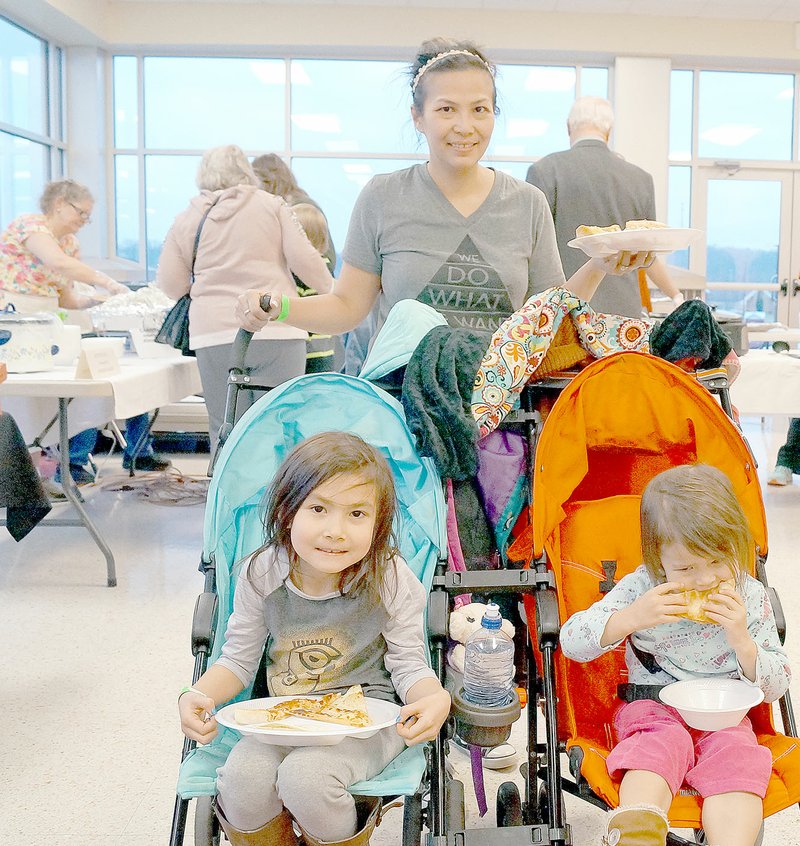 RITA GREENE MCDONALD COUNTY PRESS Hope Kelley and her children, Isabelle, left, and Olivia Kelley, enjoyed the variety of foods at the International Foodfest sponsored by the McDonald County Drug Free Scholarship Foundation on Jan. 22.