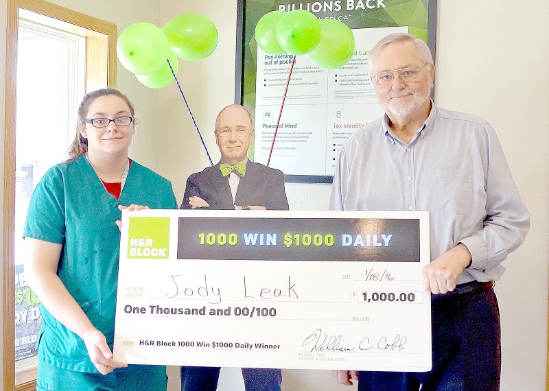 RITA GREENE MCDONALD COUNTY PRESS Jody Leak of Jane is presented a $1,000 check by Keith Taylor, tax associate manager at the Pineville H&amp;R Block office. H&amp;R Block is conducting a sweepstakes throughout the country giving away $1 million a day for 32 days.