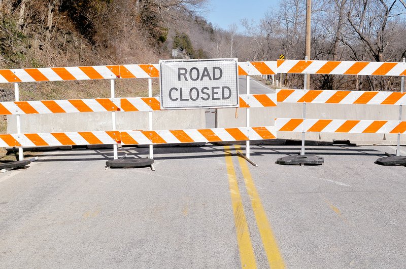 Rachel Dickerson/McDonald County Press A barricade bars traffic just in front of the area where Missouri Highway 59 was washed out by flooding. The highway will not reopen for several months, creating travel challenges for campgrounds along the Elk River.