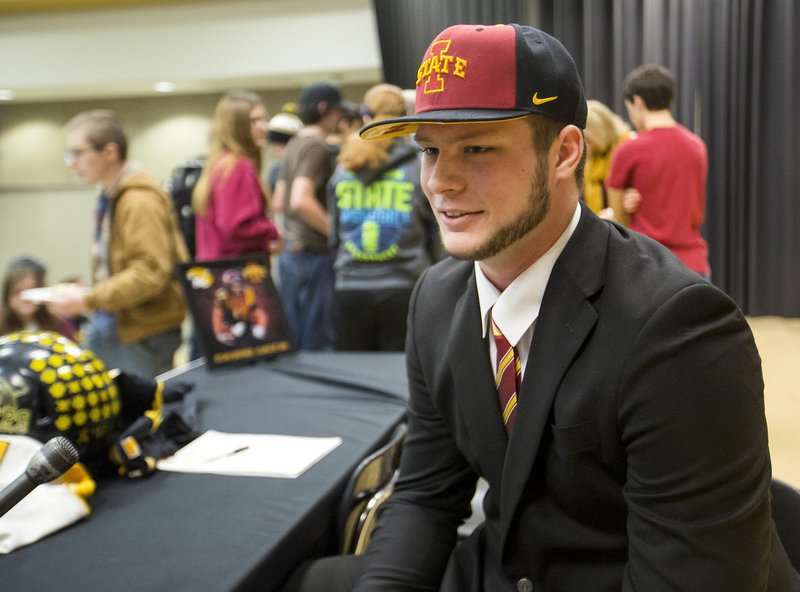 Dylan Soehner, Prairie Grove senior, talks Wednesday with reporters at Prairie Grove High School after signing a letter of intent to play football for Iowa State.