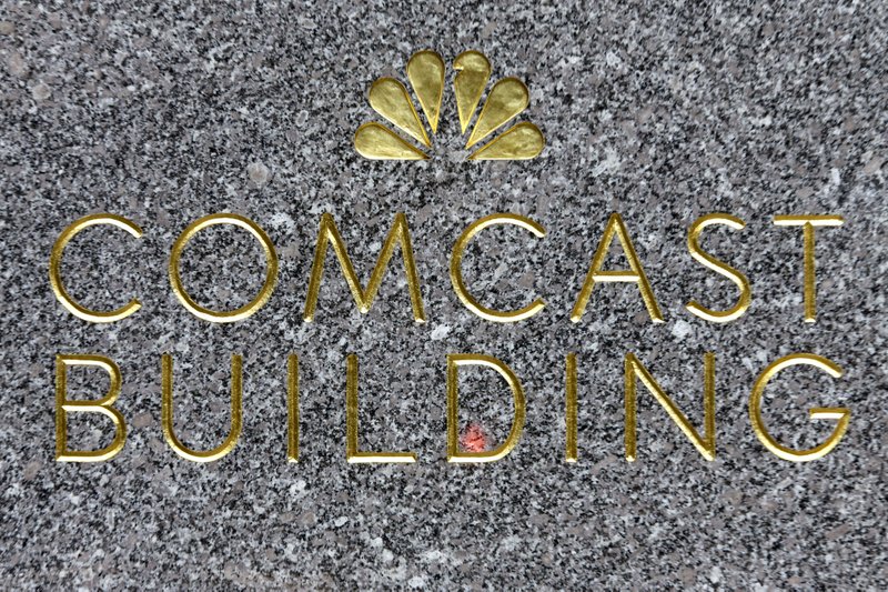 This Thursday, July 23, 2015, photo, shows the Comcast building sign at Rockefeller Center, in New York. 