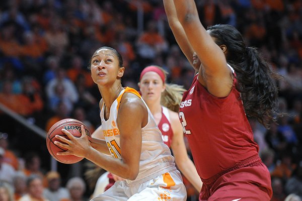Tennessee guard/forward Jaime Nared (31), prepares to take a shot while defended by Arkansas forward Khadijah West (32) during the first half of a NCAA college basketball game on Thursday, Feb. 4, 2016, in Knoxville, Tenn. Tennessee defeated Arkansas 75-57. (Caitie McMekin/Knoxville News Sentinel via AP) 