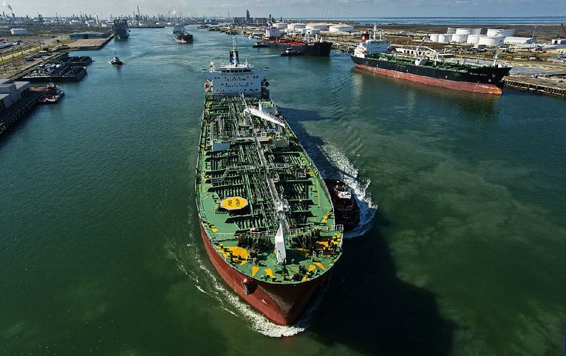 A tanker sails recently from the Citgo Refi nery dock at the Port of Corpus Christi, Texas, bound for Mexico with a load of gasoline. Some shale oil drillers in Texas continue to be profitable with oil prices under $30 a barrel. 