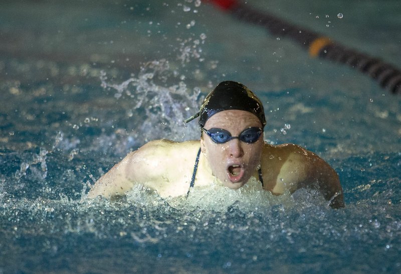 NWA Democrat-Gazette/JASON IVESTER Taylor Pike of Bentonville competes Thursday in the 100-yard butterfly during the Har-Ber Invitational at The Jones Center for Families in Springdale.