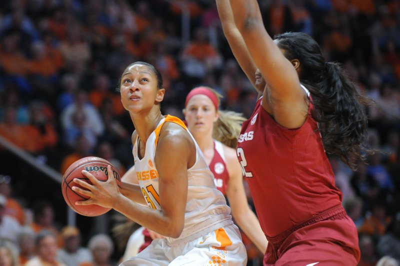 Tennessee guard/forward Jaime Nared (31), prepares to take a shot while defended by Arkansas forward Khadijah West (32) during the first half of a NCAA college basketball game on Thursday, Feb. 4, 2016, in Knoxville, Tenn.  