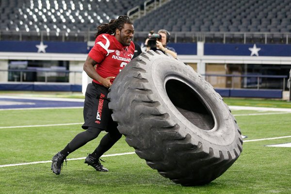 Former Arkansas running back Alex Collins participates in the Marines obstacle course at the All-Star Football Challenge on Tuesday, Feb. 2, 2016, at AT&T Stadium in Arlington, Texas. The event was aired Friday, Feb. 5, 2016, on ESPN2.