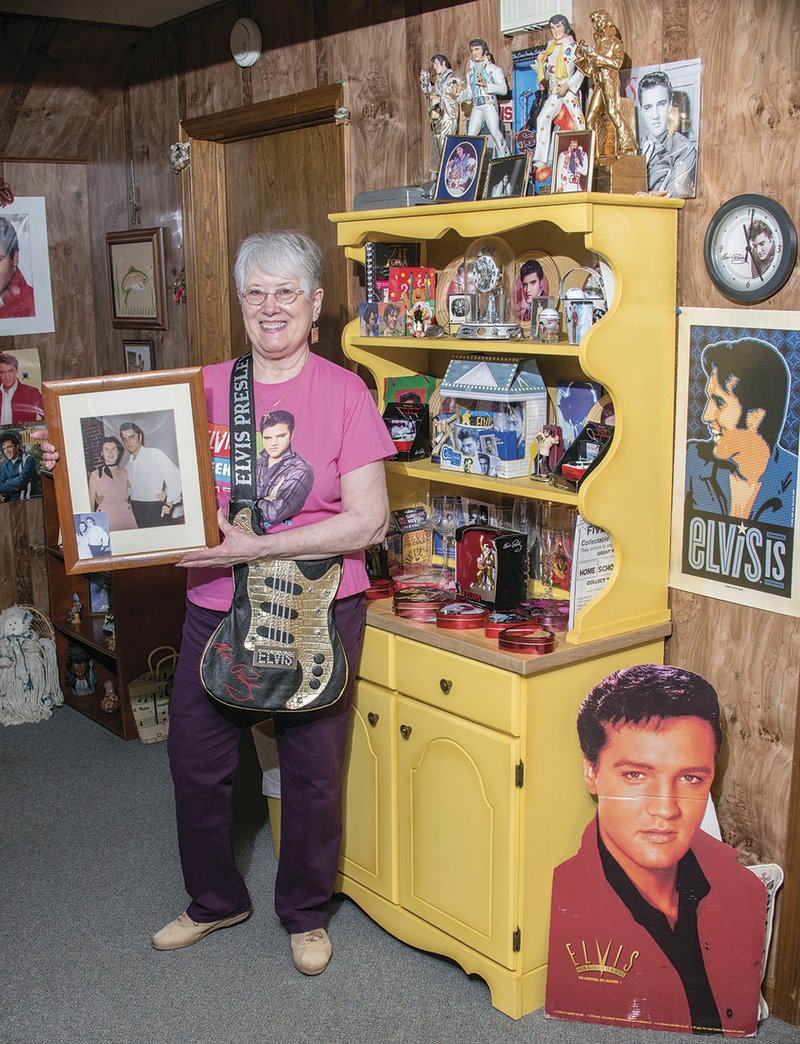 Joyce Hightower holds a photo of herself and Elvis Presley. The photo is one of the many pieces of Elvis memorabilia at Hightower’s home in Tumbling Shoals.