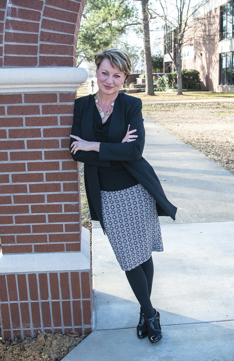 Karla Fisher, the new chancellor of Arkansas State University-Beebe, stands by the new arch at the center of the campus. Fisher earned a Bachelor of Arts degree in English from St. Mary’s University in San Antonio, Texas, and began her career as a technical writer and publications coordinator. Only later did she discover her love for college administration.