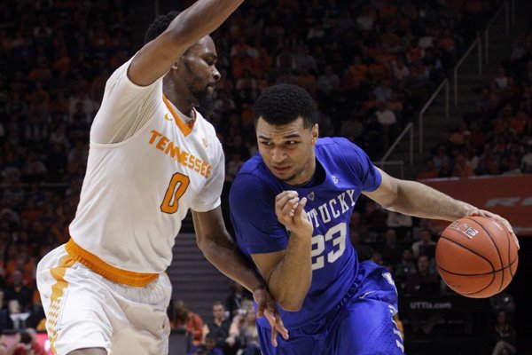 Kentucky guard Jamal Murray (23) drives against Tennessee guard Kevin Punter (0) during the first half of an NCAA college basketball game Tuesday, Feb. 2, 2016, in Knoxville, Tenn. (AP Photo/Wade Payne)