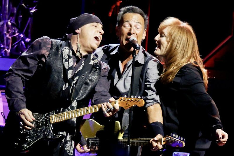 Bruce Springsteen (center) performs with wife Patti Scialfa and Stevie Van Zandt and the rest of the East Street Band in the first stop of his River Tour 16 concert on Jan. 16 in Pittsburgh. 