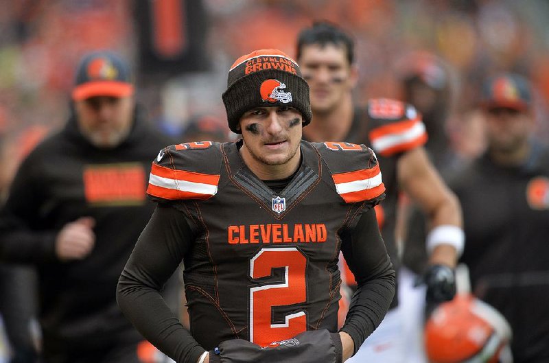 FILE - in this Dec. 6, 2015, file photo, Cleveland Browns quarterback Johnny Manziel walks off the field at halftime of an NFL football game against the Cincinnati Bengals in Cleveland. The Browns said in a statement, Tuesday, Feb. 2, 2016, that Manziel's troubles off the field have undermined his teammates and the organization. (AP Photo/David Richard, File)