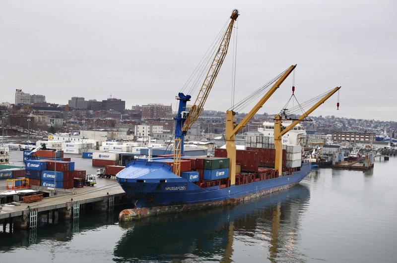 An Icelandic cargo ship is loaded in Portland, Maine, late last month. The Commerce Department said American exports fell in December for a third straight month, adding to the wider trade deficit.