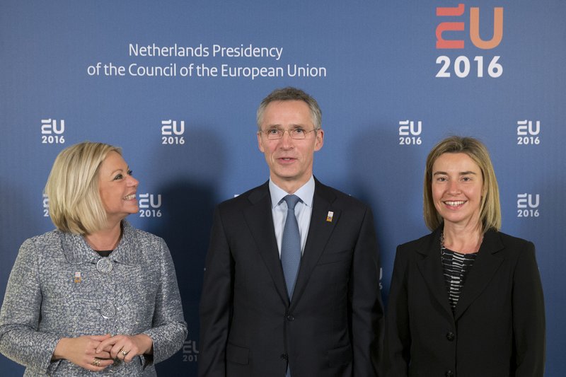 NATO Secretary-General Jens Stoltenberg poses for a picture with Netherlands Defense Minister Jeanine Hennis-Plasschaert (left) and EU representative Federica Mogherini before Friday’s meeting in Amsterdam.