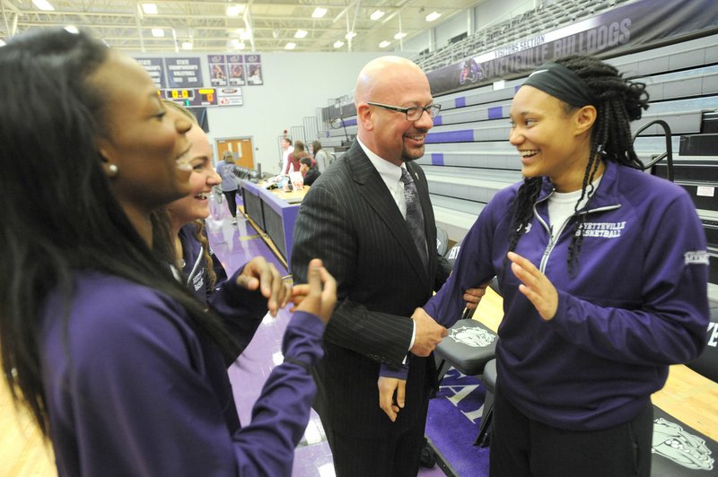 Matthew Wendt (left), new superintendent of the Fayetteville School District, speaks with DaShundra Morgan (center) and Pink Jones, members of the Fayetteville High School girls basketball team, during the school’s annual Colors Day event Friday.