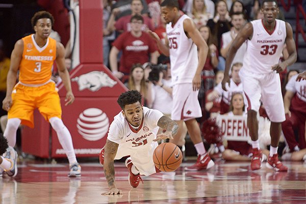 Anton Beard of Arkansas dives for a loose ball on Saturday, Feb. 6, 2016, during the game against Tennessee in Bud Walton Arena in Fayetteville.